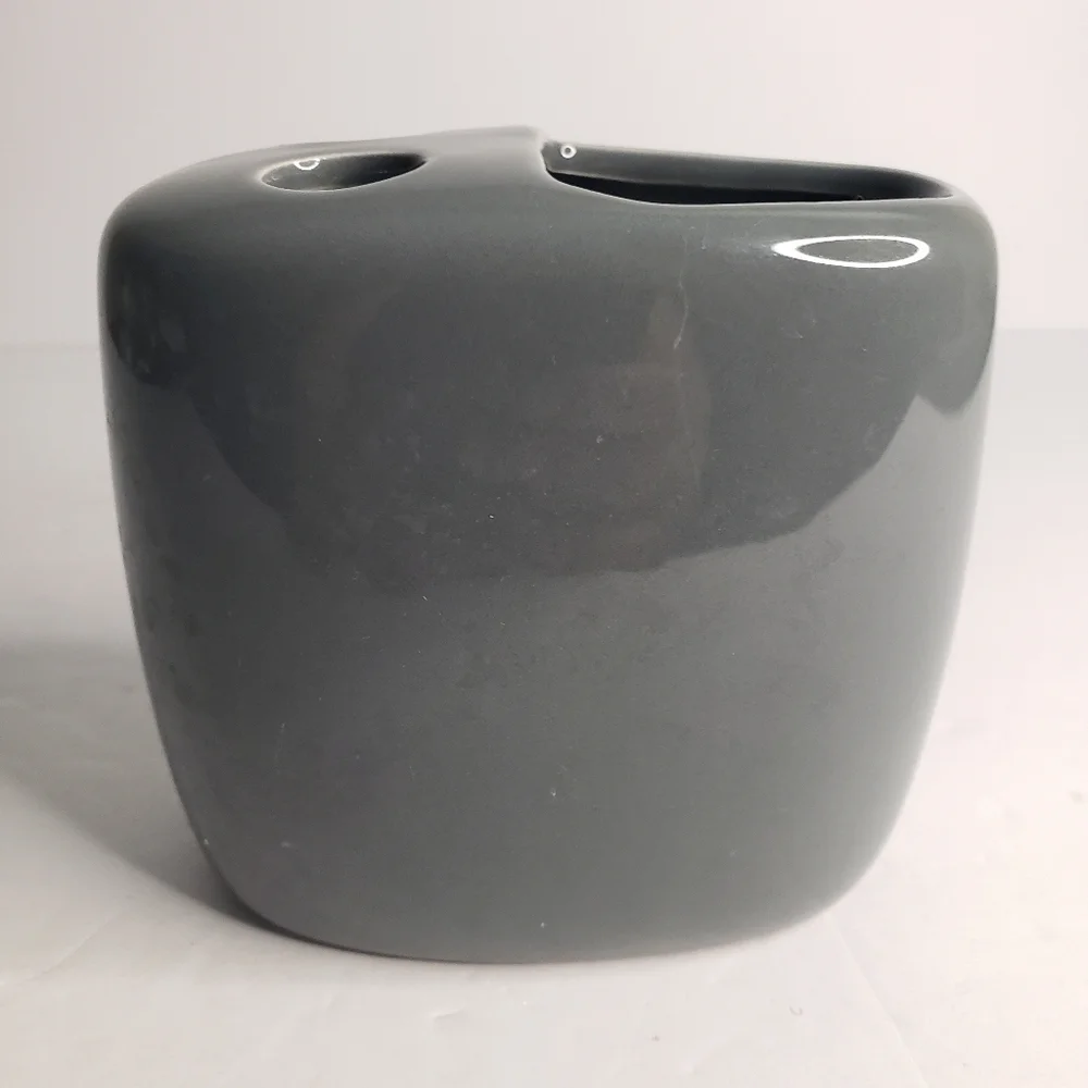 Ceramic toothbrush and toothpaste holder. 171